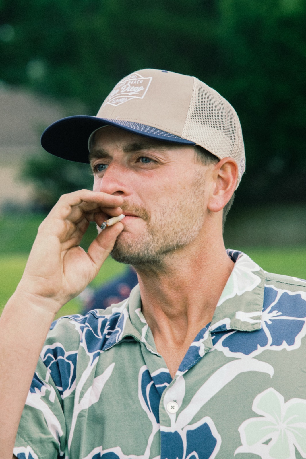 League member in a floral shirt and cap on the course