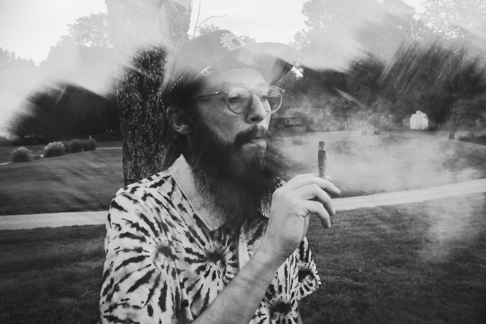 Close portrait of a bearded league member in a patterned shirt